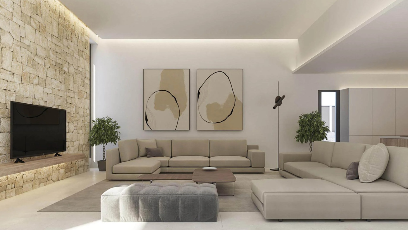 Salón moderno con pared de piedra natural, iluminación LED indirecta y amplios sofás modulares beige frente a un televisor integrado.