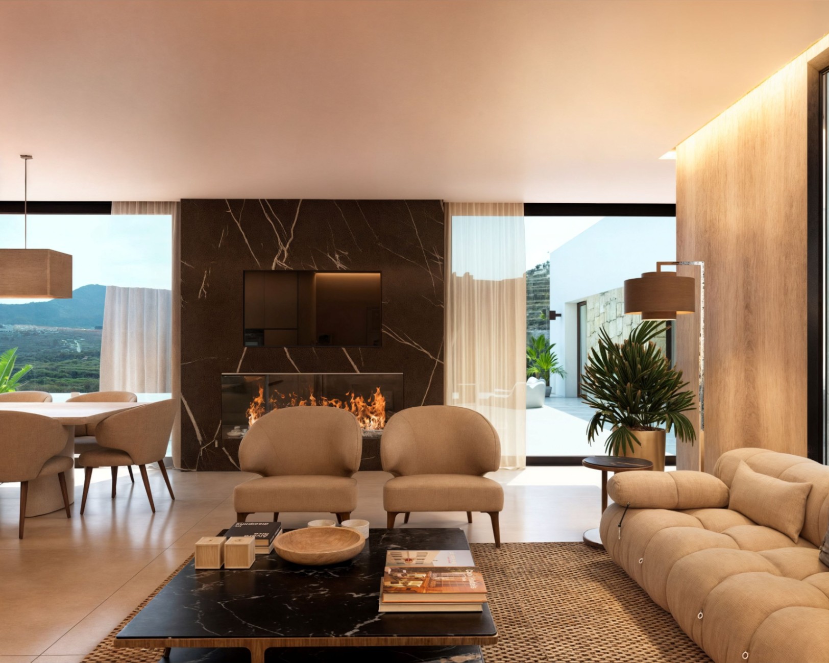 Salón moderno con pared de chimenea en mármol oscuro, televisión integrada y amplios ventanales con vistas despejadas a la montaña y terraza exterior.
