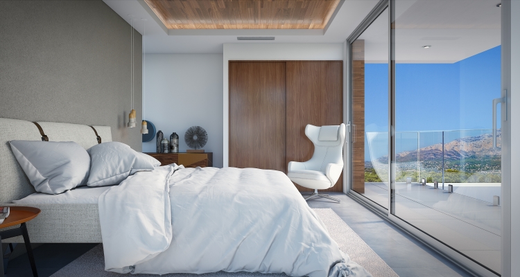 Dormitorio moderno con techo de madera, armarios empotrados y ventanales de suelo a techo que dan a una terraza con vistas panorámicas a la montaña.