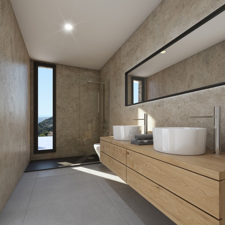Baño en suite con lavabo doble sobre mueble de madera, paredes de piedra natural, ducha italiana y ventanal vertical con vistas al exterior.